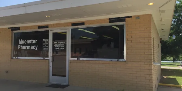 A building with a large window and a door.