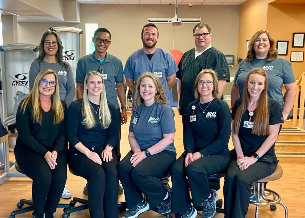 Group of healthcare professionals in a gym.