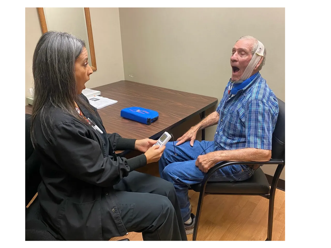 A woman and a man during a medical exam.